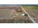 Aerial view showing home, lot, and surrounding farmlands at 7275 Lake Hendry Rd, Fort Meade, FL 33841