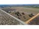 Aerial view of property near a road, showing farmland and trees at 7275 Lake Hendry Rd, Fort Meade, FL 33841