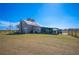 Tan house exterior with a covered porch at 7275 Lake Hendry Rd, Fort Meade, FL 33841