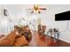 Bright living room with hardwood floors, ceiling fan, and open layout at 7275 Lake Hendry Rd, Fort Meade, FL 33841