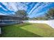 Large backyard featuring a screened pool at 781 Sagewood Dr, Lakeland, FL 33813