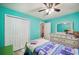 Bedroom with twin bed, dresser, and ceiling fan at 781 Sagewood Dr, Lakeland, FL 33813