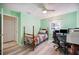 Bedroom with twin bed, desk, and ceiling fan at 781 Sagewood Dr, Lakeland, FL 33813