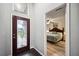 Entry hall with glass door and view into main bedroom at 781 Sagewood Dr, Lakeland, FL 33813