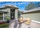 Charming front patio with seating area and fire pit at 781 Sagewood Dr, Lakeland, FL 33813