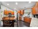 Kitchen with wood cabinets, granite counters, and stainless steel appliances at 781 Sagewood Dr, Lakeland, FL 33813