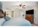 Spacious main bedroom with king-size bed and large TV at 781 Sagewood Dr, Lakeland, FL 33813