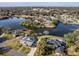 Aerial view of waterfront property showcasing two homes at 825 E Mann Rd, Bartow, FL 33830