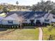 Single story home with gray roof and brick facade at 825 E Mann Rd, Bartow, FL 33830