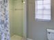 Updated bathroom with a shower, toilet and vanity at 825 E Mann Rd, Bartow, FL 33830