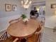 Elegant dining room featuring a classic wood table and chandelier at 825 E Mann Rd, Bartow, FL 33830