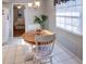 Cozy kitchen nook with a round wooden table and white chairs at 825 E Mann Rd, Bartow, FL 33830