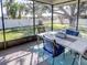 Relaxing screened porch with outdoor seating at 825 E Mann Rd, Bartow, FL 33830