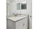 Bathroom featuring granite countertop, modern faucet, and white vanity at 9419 Se 163Rd St, Summerfield, FL 34491