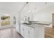 Well-lit kitchen featuring granite countertops and modern appliances at 9419 Se 163Rd St, Summerfield, FL 34491