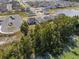 Panoramic aerial shot of a residential community near a lake with parking and a greenbelt at 951 Craftsman Rd, Eagle Lake, FL 33839