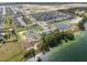 Wide aerial perspective of homes surrounding a lake in a planned community at 951 Craftsman Rd, Eagle Lake, FL 33839