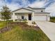 Two-story house with front porch and landscaped lawn at 951 Craftsman Rd, Eagle Lake, FL 33839