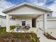 Covered porch with seating area, great for relaxing at 951 Craftsman Rd, Eagle Lake, FL 33839