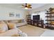 Living room with sectional sofa and built-in shelving at 951 Craftsman Rd, Eagle Lake, FL 33839