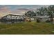 Home with screened pool and expansive backyard at sunset at 9585 Shreck Rd, Bartow, FL 33830