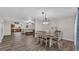 Bright dining room with a farmhouse table and chandelier at 9585 Shreck Rd, Bartow, FL 33830