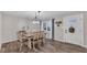 Bright dining room with a farmhouse table and chandelier at 9585 Shreck Rd, Bartow, FL 33830