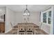 Bright dining room with a farmhouse table and chandelier at 9585 Shreck Rd, Bartow, FL 33830