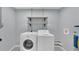 Laundry room with washer, dryer, and additional shelving at 9585 Shreck Rd, Bartow, FL 33830