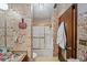 Bathroom with shower/tub combo and vintage wallpaper at 1005 Shadow Run Dr, Lakeland, FL 33813