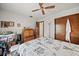 Bedroom with wooden dresser and a queen-size bed at 1005 Shadow Run Dr, Lakeland, FL 33813