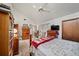 Bedroom with wooden dresser, book shelf and a queen-size bed at 1005 Shadow Run Dr, Lakeland, FL 33813