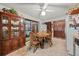 Bright dining area features a round table with four chairs and a wooden hutch at 1005 Shadow Run Dr, Lakeland, FL 33813