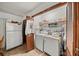 Laundry room with washer, dryer, and shelving for storage at 1005 Shadow Run Dr, Lakeland, FL 33813