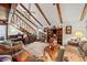 High-ceilinged living room with exposed beams and a lofted area at 1005 Shadow Run Dr, Lakeland, FL 33813