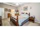 Bright bedroom with wooden furniture and ensuite bathroom at 1012 Robin Ln, Winter Haven, FL 33884