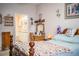 Bedroom with ensuite bathroom and wooden furnishings at 1012 Robin Ln, Winter Haven, FL 33884