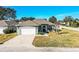 One-story house with a two-car garage and a brick driveway at 1012 Robin Ln, Winter Haven, FL 33884