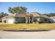 One-story house with a two-car garage and well-manicured lawn at 1012 Robin Ln, Winter Haven, FL 33884