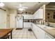 White kitchen features stainless steel appliances and lots of cabinet space at 1012 Robin Ln, Winter Haven, FL 33884