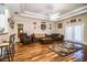 Spacious living room featuring hardwood floors, comfy furniture, and a cozy atmosphere at 1012 Robin Ln, Winter Haven, FL 33884