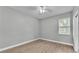 Bright bedroom with wood-look flooring and ceiling fan at 1033 Fleming Ave, Lakeland, FL 33815