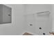 Convenient laundry room with wire shelving for storage at 1033 Fleming Ave, Lakeland, FL 33815