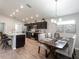 View of kitchen, dining area, and living room with hardwood floors at 1048 Mountain Flower, Davenport, FL 33837