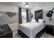 Modern bedroom with gray and white color scheme and guitar decor at 1135 Aruba Ave, Mulberry, FL 33860