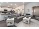 Living room with gray sofas, white coffee table, and open floor plan at 1135 Aruba Ave, Mulberry, FL 33860