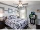 Bright bedroom with a full-size bed and window at 1148 Aruba Ave, Mulberry, FL 33860