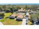 Aerial view of single-Gathering home with screened pool, RV parking, and multi-car driveway at 1325 Fairlee St, Lakeland, FL 33813