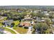 Aerial neighborhood view showcasing houses with pools, RV parking, and manicured lawns at 1325 Fairlee St, Lakeland, FL 33813