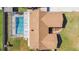 Aerial view of a home with screen enclosed pool, RV parking, and an inviting backyard at 1325 Fairlee St, Lakeland, FL 33813